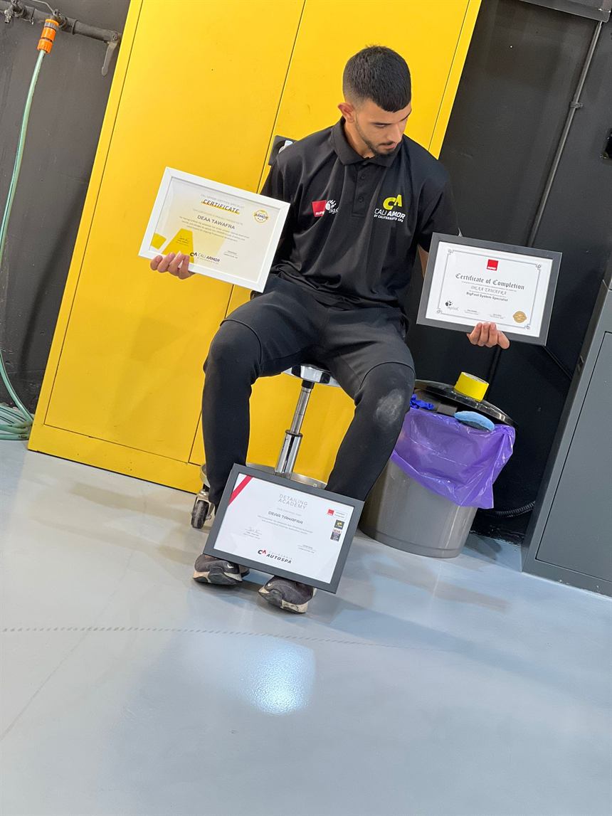 DODO's detailer holding three detailing-academy certificates
